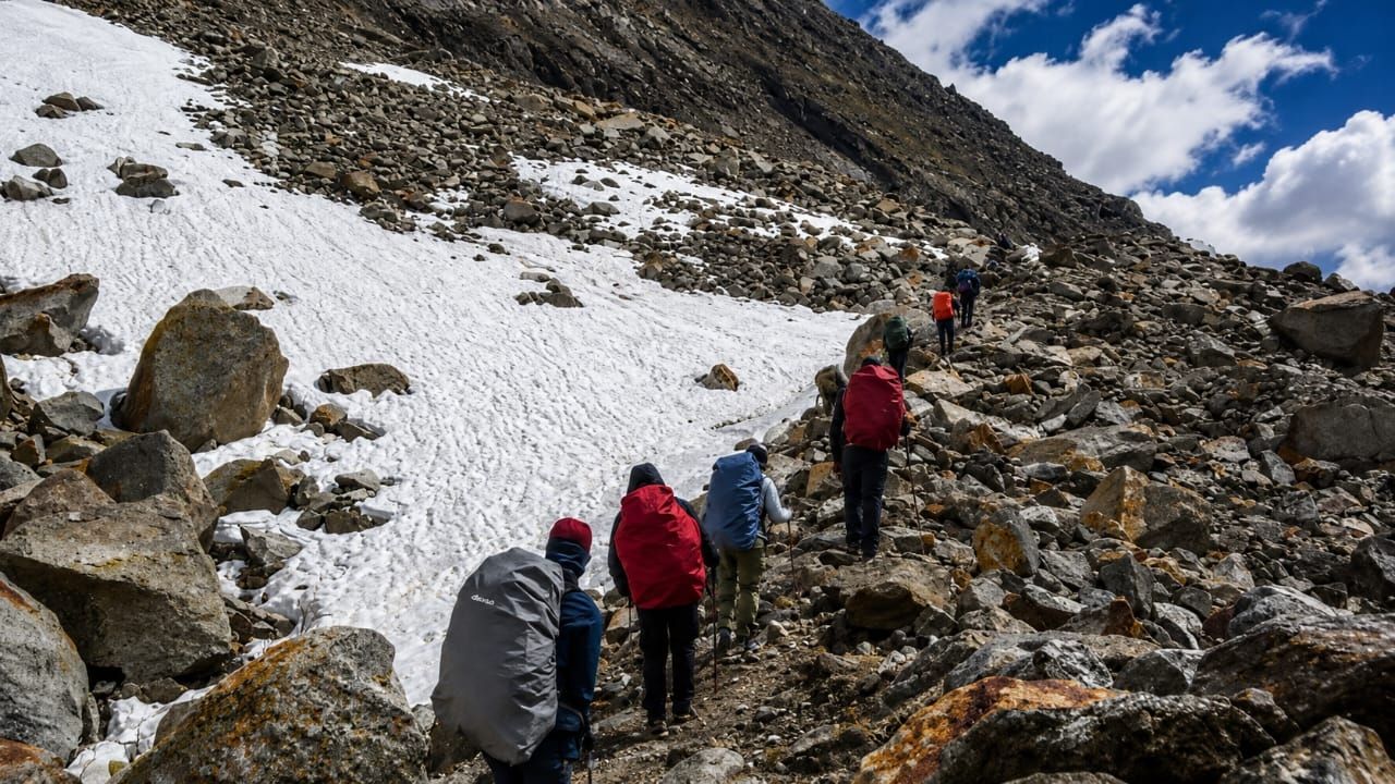 Monk Trails trekking group climbing a snow slope in Himachal Pradesh